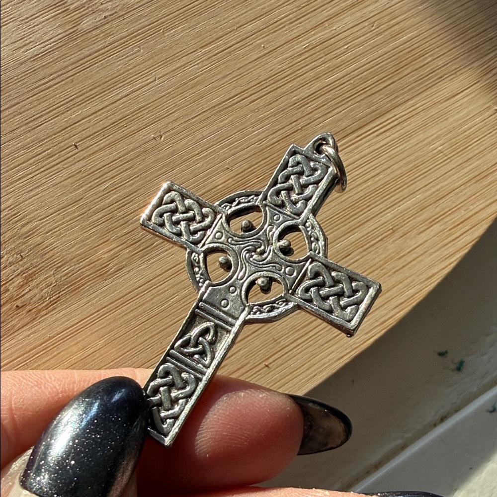 Celtic Cross, a traditional cross featuring a circle (nimbus) Silver toned